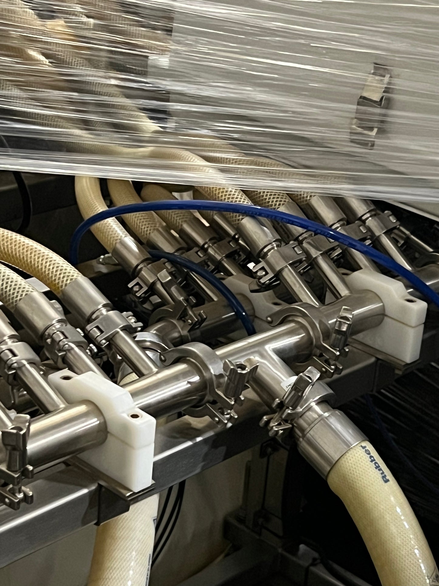 Slightly Used Inline Filling Systems - Overflow Filler - 16-20 Head Pressure overflow hot filler, with feed tank, Serial # 46910, 220 Volt