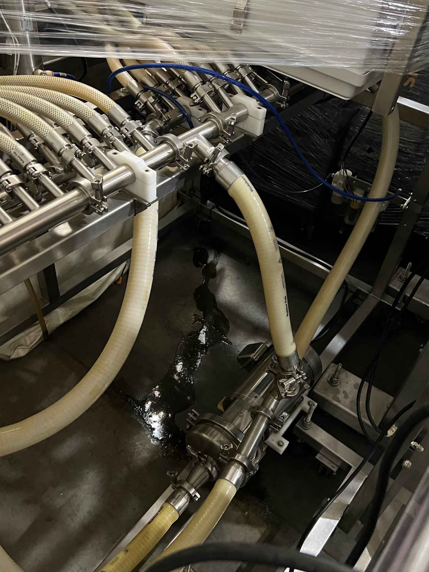 Slightly Used Inline Filling Systems - Overflow Filler - 16-20 Head Pressure overflow hot filler, with feed tank, Serial # 46910, 220 Volt