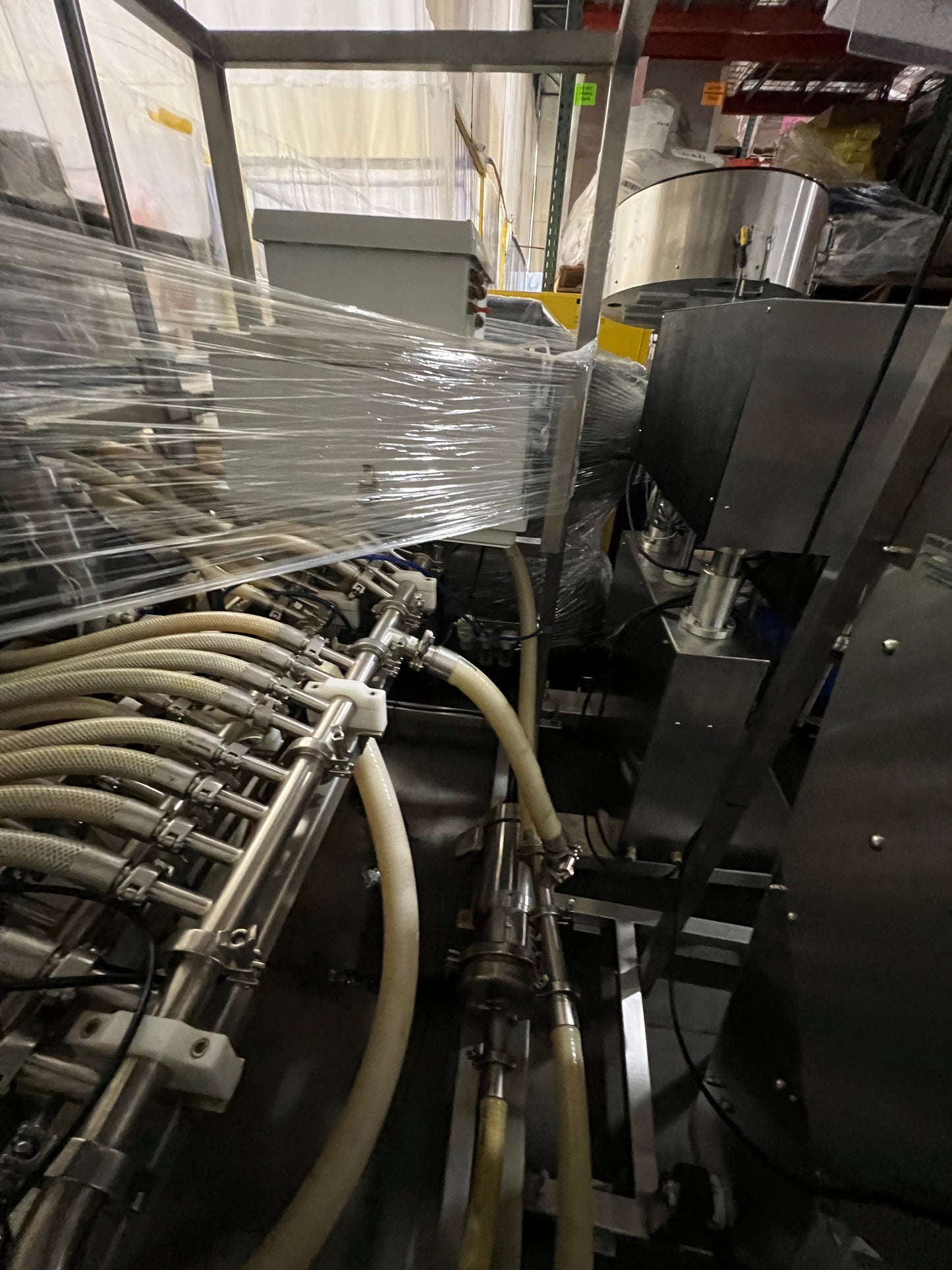 Slightly Used Inline Filling Systems - Overflow Filler - 16-20 Head Pressure overflow hot filler, with feed tank, Serial # 46910, 220 Volt