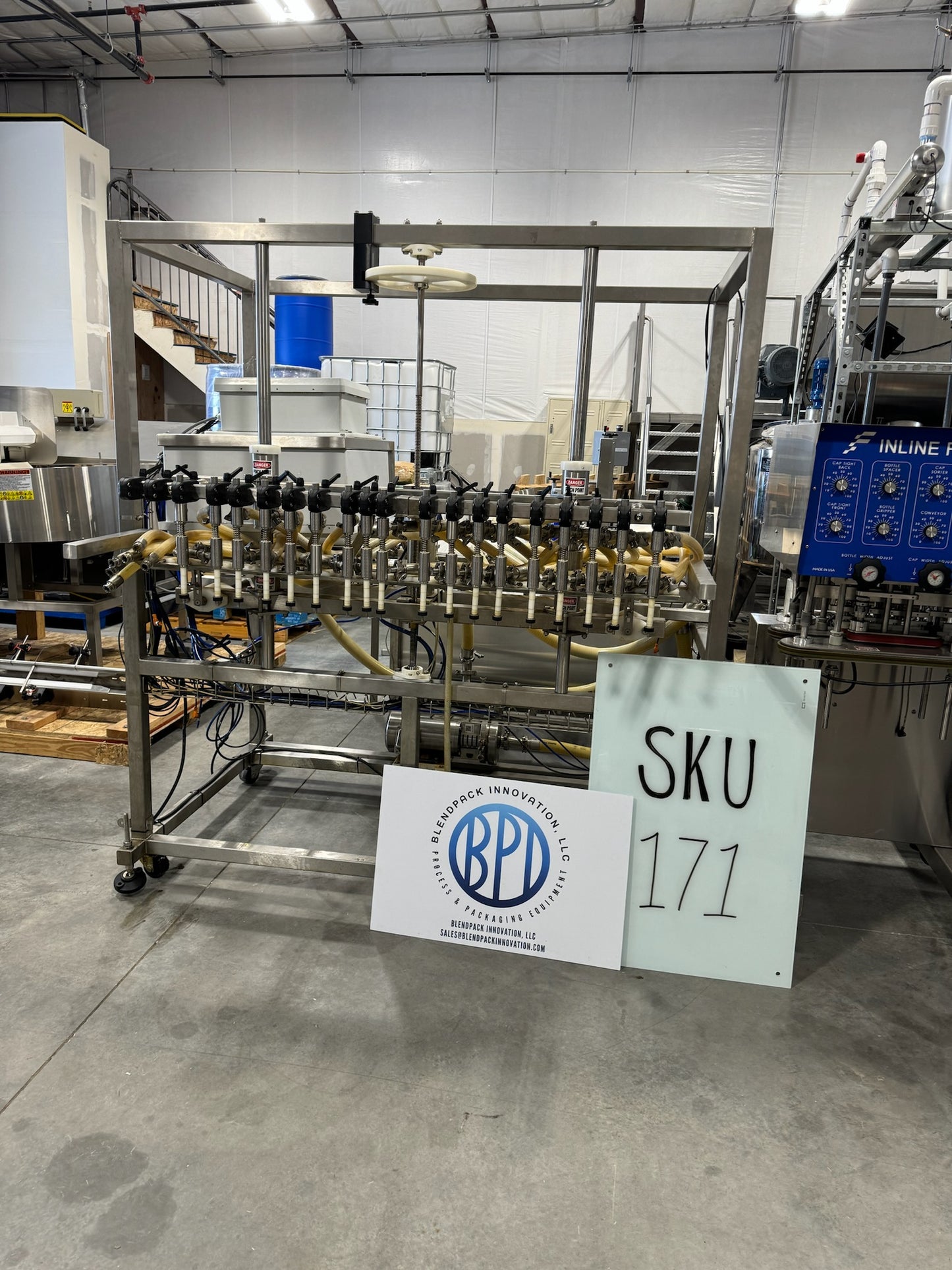 Slightly Used Inline Filling Systems - Overflow Filler - 16-20 Head Pressure overflow hot filler, with feed tank, Serial # 46910, 220 Volt