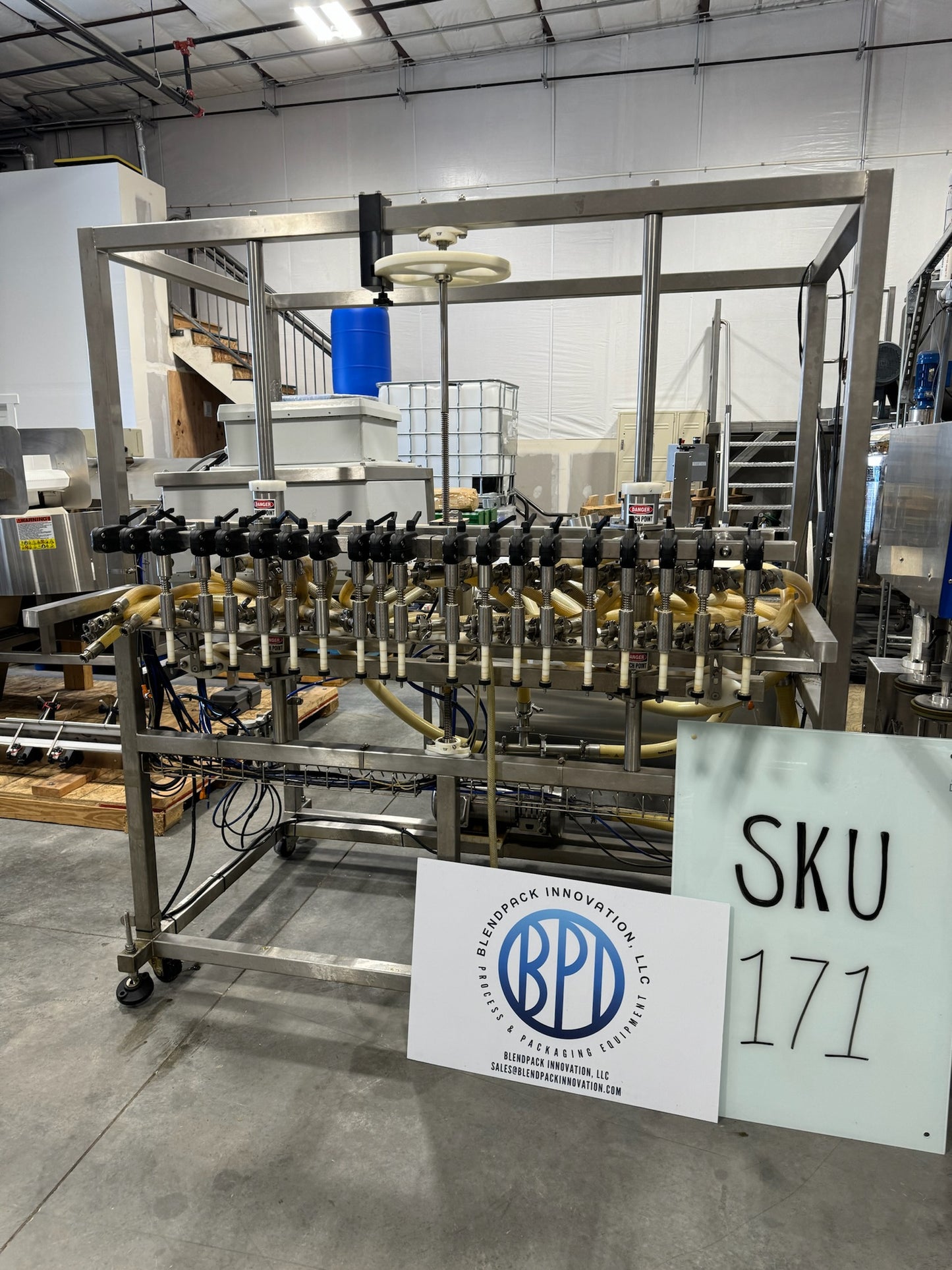 Slightly Used Inline Filling Systems - Overflow Filler - 16-20 Head Pressure overflow hot filler, with feed tank, Serial # 46910, 220 Volt