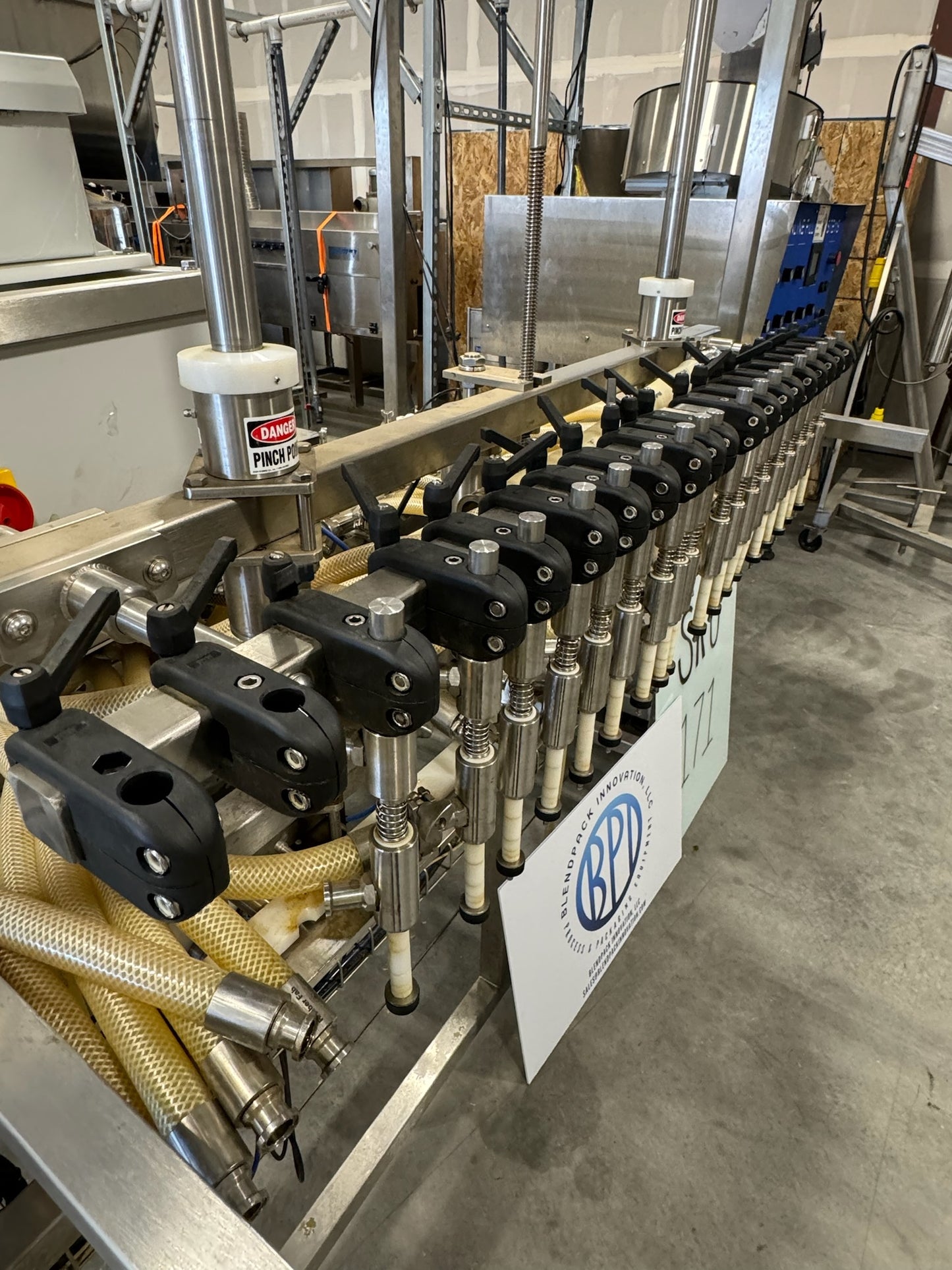 Slightly Used Inline Filling Systems - Overflow Filler - 16-20 Head Pressure overflow hot filler, with feed tank, Serial # 46910, 220 Volt