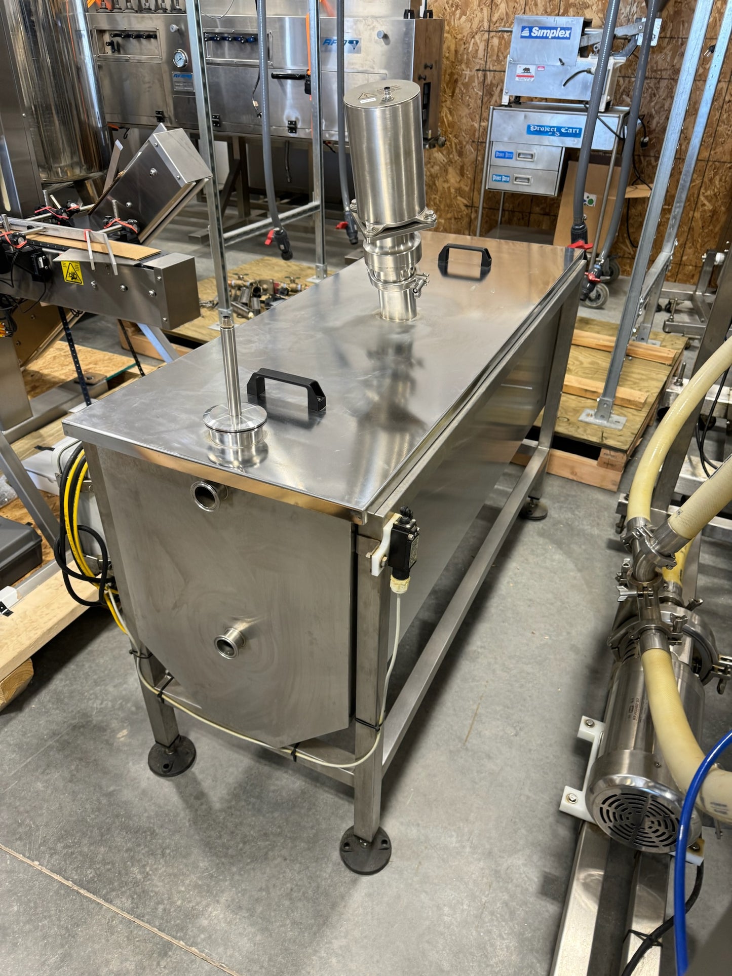 Slightly Used Inline Filling Systems - Overflow Filler - 16-20 Head Pressure overflow hot filler, with feed tank, Serial # 46910, 220 Volt